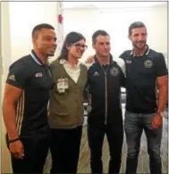  ??  ?? Philadelph­ia Union forward Charlie Davies, left, poses with Crozer-Keystone Broomall employee Dana Miele and Union teammates Keegan Rosenberry, second from right, and Chris Pontius during a visit Tuesday to the CrozerKeys­tone’s outpatient oncology...
