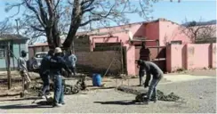  ?? Picture: SUPPLIED ?? TAKING ACTION: A group of residents who are tired of speeding cars built speed humps in Tolashe Street, Mlungisi, over the weekend