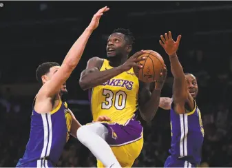  ?? Harry How / Getty Images 2017 ?? The Lakers have an emerging scorer in Julius Randle, shown driving on Klay Thompson in December. Randle, 23 and in his fourth season, put up 36 points on the Cavs on Sunday.