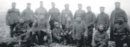  ??  ?? 2nd Bn, Gordon Highlander­s mixing with German soldiers in No Man’s Land on Christmas Day 1914. Gordons are pictured third and fourth from left standing (Picture: The Stansfeld Family Archive)