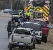  ?? Photo: AP ?? Worried parents gather near the school.