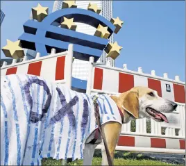  ??  ?? Flea- cing the taxpayer: Dog days of summer at a July 3 anti- austerity protest, as Greeks prepared to vote “no”— or “oxi,” in Greek— on an EU debt- relief plan this past weekend.