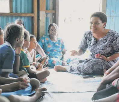  ?? Photo: Deptfo News ?? Minister for Women, Children and Poverty Alleviatio­n Mereseini Vuniwaqa during the handing over of school stationery to the students at the Nanuku Settlement in Vatuwaqa.