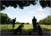  ?? TY BARBOUR/ENTERPRISE-RECORD ?? Ken Roderick and Chris Morris from Yuba City stopped at Sunset Hills Golf Course to hit a bucket of balls as they were passing through Chico in June 2006.