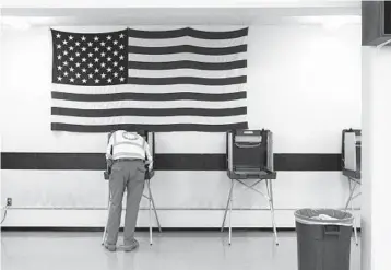  ?? LAUREN JUSTICE/THE NEW YORK TIMES 2020 ?? A voter fills out a ballot at a polling place in Reedsburg, Wisconsin.