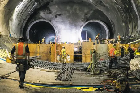  ?? Jessica Christian / The Chronicle ?? Constructi­on crews work on the two main tunnels and the platform area of the future Central Subway station in Chinatown.