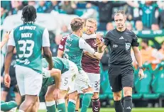  ?? ?? Felix Passlack and Stephen Kingsley are caught in a tussle