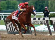  ?? ASSOCIATED PRESS ?? IN THIS JUNE 9, 2018, FILE PHOTO, Justify, jockey Mike Smith, crosses the finish line to win the 150th running of the Belmont Stakes horse race and the Triple Crown at Belmont Park in Elmont, N.Y.