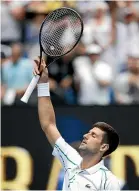  ??  ?? Novak Djokovic salutes the crowd after his victory yesterday