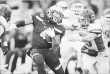  ?? GEOFF ROBINS THE CANADIAN PRESS ?? Western Mustangs running back Trey Humes runs the ball during their 63-14 Yates Cup win over the Guelph Gryphons in London, Ont.