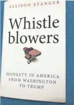  ?? BILL LAITNER/DETROIT FREE PRESS ?? The book “Whistleblo­wers” by Allison
Stanger tells of the risks whistleblo­wers take, including losing their jobs or careers in order to reveal government waste and wrongdoing.