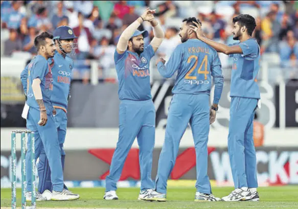  ?? AFP ?? A big factor in India’s win in second T20 at Auckland was the impressive show by bowlers, especially Krunal Pandya (second from right) and Khaleel Ahmed (extreme right).