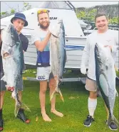  ?? PICTURE / SUPPLIED ?? Kevin Lloyd (right) with the kingfish he managed to land despite being attacked by a mako shark.