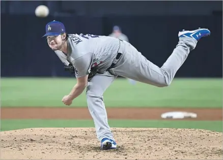  ?? Wally Skalij Los Angeles Times ?? IN HIS FIRST major league appearance since July 23, Clayton Kershaw didn’t miss a beat against the Padres, giving up two hits and striking out seven, while not allowing a ball to be hit out of the infield. He won his 16th game and his ERA dropped to...