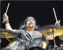  ??  ?? The Associated Press Vinnie Paul at a 2014 Hellyeah concert in Hershey, Pa. The heavymetal icon died Friday in Las Vegas.