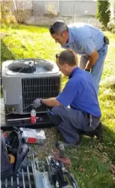  ??  ?? The owners of Triple T Cooling and Heating and HRC Climate Services donated equipment and labor to help a family in need.