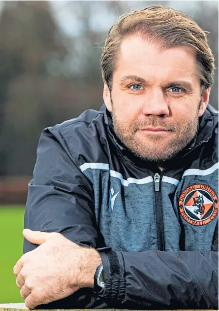  ?? Picture: SNS Group. ?? Dundee United boss Robbie Neilson, who is working on assignment­s for his Master’s degree during the shutdown.