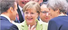  ?? FOTO: DPA ?? Frankreich­s Präsident Emmanuel Macron, Kanzlerin Angela Merkel und Premiermin­isterin Theresa May gestern Abend in Brüssel.