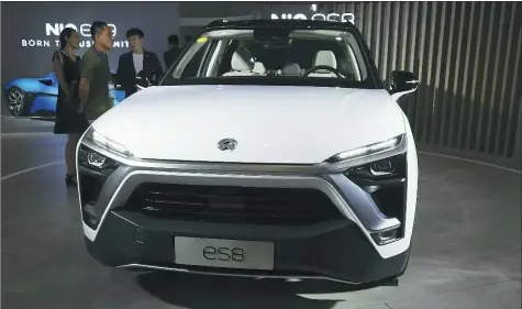  ?? WU CHANGQING / FOR CHINA DAILY ?? Chinese electric vehicle startup Nio’s ES8 SUV is displayed at a new energy tech show in Beijing.