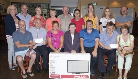  ??  ?? Presentati­on of a cheque of €1,000 each to St Mary’s Cemetery Commitee, Enniscorth­y Meals on Wheels and two flat screen TVs to St John’s Hospital in Bellefield GAA Complex, proceeds raised by the Robert ‘Tex’ Byrne Memorial Match.