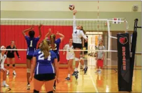  ??  ?? Boyertown’s Taylor Jones rises up to return a shot during Thursday’s game against Norristown.