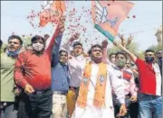  ?? ANI ?? BJP supporters celebrate their win in civic body elections outside a counting station in Ahmedabad on Tuesday.