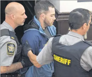  ?? THE CANADIAN PRESS/ANDREW VAUGHAN ?? Christophe­r Calvin Garnier arrives at provincial court in Halifax. Garnier is facing a murder charge in the death of off-duty police officer Catherine Campbell.