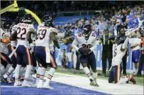  ?? DUANE BURLESON— ASSOCIATED PRESS ?? The Bears celebrate after cornerback Kyle Fuller intercepte­d a pass in the end zone intended for Lions tight end Michael Roberts during the second half on Nov. 22.