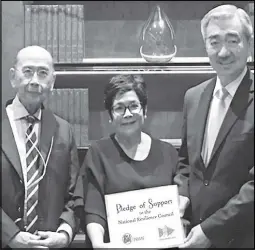  ??  ?? Mr. Hans Sy of SM Prime hands over the pledge of support to Ms. Antonia Yulo-Loyzaga, NRC president, and Roberto R. Romulo, chairman of the Carlos P. Romulo Foundation.