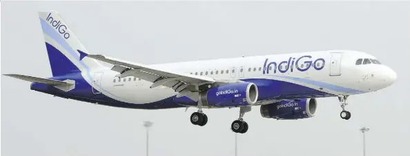  ?? AFP/GETTY IMAGES ?? A passenger on an IngiGo plane had to be removed after he attempted to enter the cockpit to charge his cellphone.