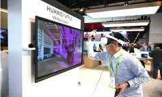  ??  ?? An attendee plays the Huawei VR2 virtual reality music game on the last day of CES 2019 at the Las Vegas Convention Centre in Las Vegas, Nevada. — AFP photo