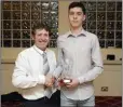  ??  ?? Joseph O’Shea from Ashford AC accepts the Under-16-19 award from Bill Porter.