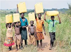  ??  ?? Ugandan villagers, including children, regularly fetch water in large plastic containers