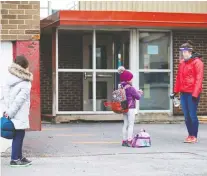  ?? CHRISTINNE MUSCHI/REUTERS FILES ?? Students in Saint-jean-sur-richelieu line up to have their hands sanitized back in May.