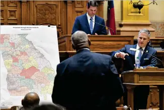  ?? HYOSUB SHIN/HYOSUB.SHIN@AJC.COM ?? Sen. John Kennedy (right), R-macon, answers a question from Sen. Emanuel Jones, D-decatur, during a hearing on new Senate districts on Tuesday at the Georgia Capitol. The Legislatur­e is in special session to draw new political maps for the state House, state Senate and Congress.