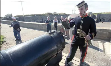  ??  ?? Craig Hyatt checks the noon gun prior to firing.