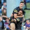  ?? GETTY ?? Panthers pair Tyrone May and Nathan Cleary, top, celebrate May’s try.