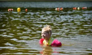  ?? ?? Mable Thayn, 5, of Harrison City, came to the beach with her mother, Rachel, and three siblings.