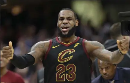  ?? TONY DEJAK — THE ASSOCIATED PRESS ?? LeBron James celebrates after scoring the game-winning shot in Game 5 of a first-round playoff series against the Indiana Pacers on April 25 at Quicken Loans Arena.