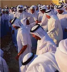  ??  ?? Shaikh Tamim, Shaikh Hamad and other shaikhs during the funeral of Shaikh Khalifa in Doha yesterday.