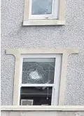  ??  ?? A bullet hole in the window of the house in Larne