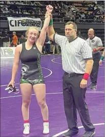  ?? PHOTO BY CURTIS NELSON ?? Reese Hart is named the victor after winning her third-place bout at the CIF Central Section Masters Tournament. With the victory, Hart qualified to compete at the state tournament this weekend at Mechanics Bank Arena in Bakersfiel­d.