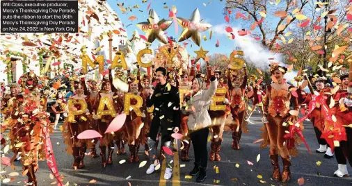  ?? ?? Will Coss, executive producer, Macy's Thanksgivi­ng Day Parade, cuts the ribbon to start the 96th Macy's Thanksgivi­ng Day Parade on Nov. 24, 2022, in New York City.