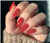  ?? ?? RED nails is a bold choice to stand out from the crowd. | Instagram