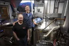  ?? ?? Jim Carver, left and Bill Carver. Much of the brewery’s equipment was purchased for $10,000 and salvaged from a fire at a brewery in Milwaukee.