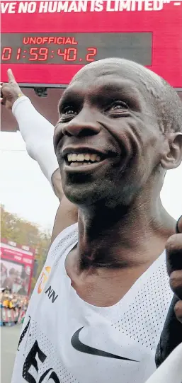  ?? AP. Picture: ?? Eliud Kipchoge points out his stunning subtwo hour marathon mark, set in Vienna last weekend.