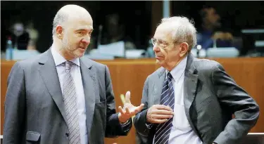  ?? Ansa ?? Su fronti opposti Il commissari­o Ue agli Affari economici, Pierre Moscovici e il ministro Pier Carlo Padoan