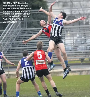  ??  ?? BIG MEN FLY: Stawell’s Jack Beaton and Minyipmurt­oa’s Kieran Delahunty in a ruck contest during a Wimmera Football League clash at Stawell’s Central Park. Picture: PAUL CARRACHER