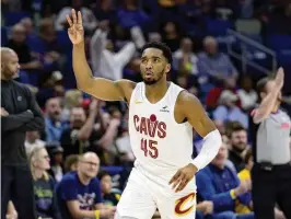  ?? AP ?? Cleveland Cavaliers guard Donovan Mitchell celebrates a 3-pointer against the New Orleans Pelicans earlier this month. Team owner Dan Gilbert is confident the All-Star guard will sign a long-term contract to chase an NBA championsh­ip with Cleveland.