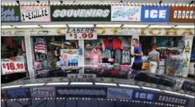  ?? ROBERT F. BUKATY — THE ASSOCIATED PRESS ?? A souvenir shop attracts tourists in Old Orchard, Beach, Maine. Canadians may be angry about President Donald Trump’s insults and tariffs, but it doesn’t seem to be taking a toll on tourism.